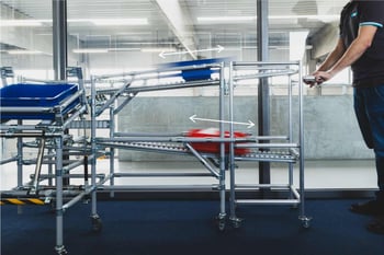 Short flow rack with rocker function and return level for empty containers
