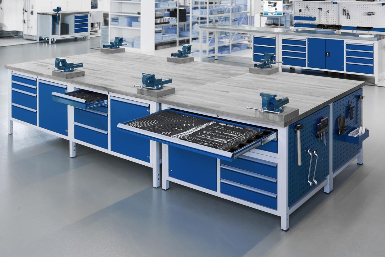 Several workbenches each with many built-in elements and neatly stored tools