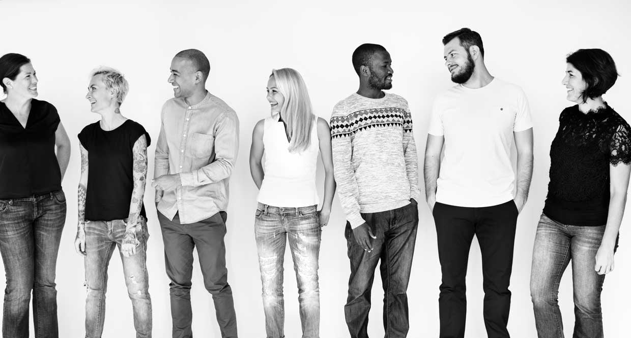 Men and women laugh and form a mixed team - WaVision Holding AG Team